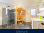 Badezimmer mit Walk In Dusche - Premium Ferienhaus in bester Lage von Göhren: Exklusives Massivhaus mit etablierter Ferienvermietung