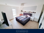 Schlafzimmer II mit Balkon - 125m² DHH im Ostseebad Baabe, 5 Zimmer, Top-Ausstattung, zwei Bäder, Kamin! Seeblick inklusive!