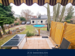 Blick auf Terrasse I - Ihr Traumhaus in Blankenfelde: Modern, großzügig, mit Pool, Garage & viel Platz für die Familie!