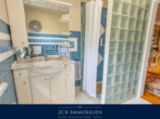 und Dusche - Einfamilienhaus auf zwei Ebenen mit großem, pflegeleichten Garten, Wintergarten, Terrasse, Garage!